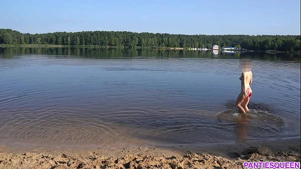 Naked girl goes skinny dipping in public beach